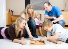 Image of family playing backgammon