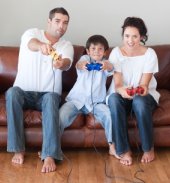 Young family playing video game together